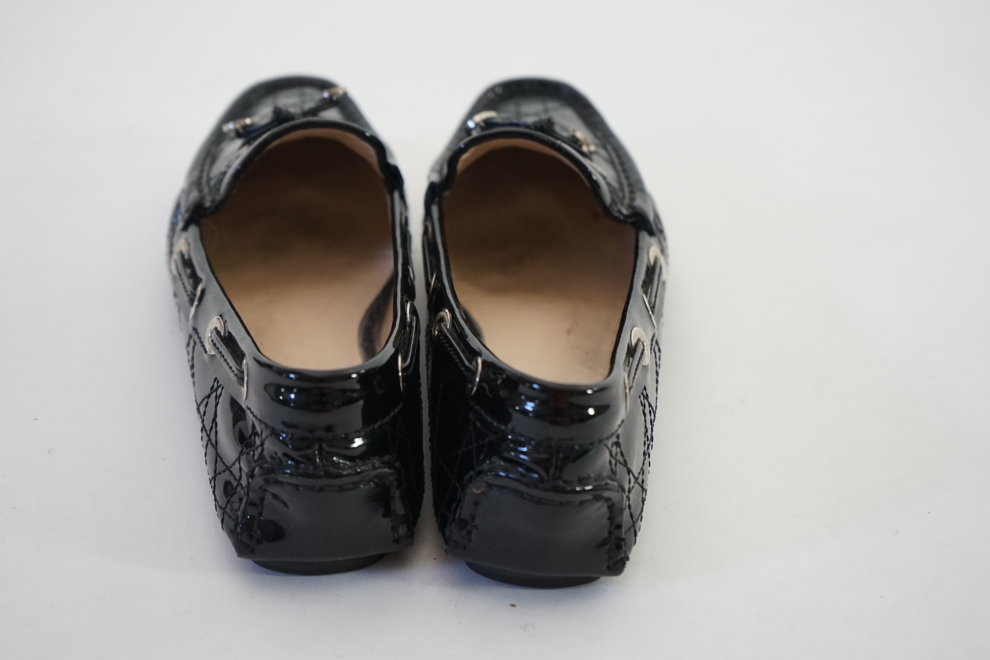 A pair of Christian Dior black patient leather lady's driving shoes with dustbag and in original box. Size 38.5. Proceeds to Happy Paws Puppy Rescue